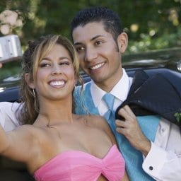 Teenage Girl Snapping Photo at Prom